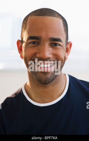 Mixed race man smiling Stock Photo