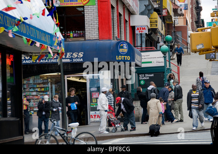 East Harlem street corner with local people of the community Stock Photo