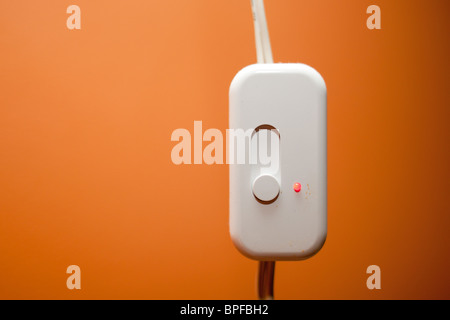 A white plastic dimmer switch. Stock Photo