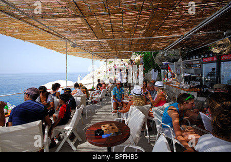 DUBROVNIK, CROATIA. Drinking and looking out to sea from Buza, a popular bar by the old city walls. 2010. Stock Photo