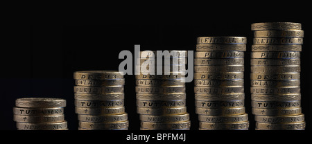 Piles Of Pound Sterling Coins On A Black Background Stock Photo