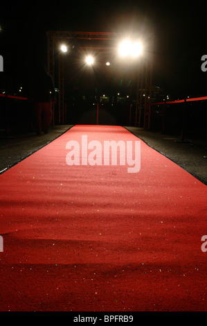 Red carpet in floodlight Stock Photo