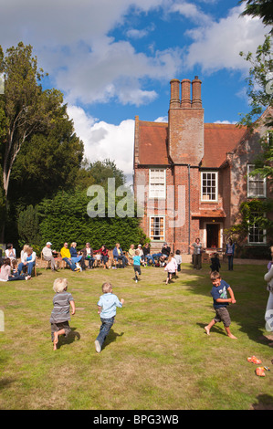 Children compete in the running race at a village fete in Weston , Suffolk , England , Great Britain , Uk Stock Photo