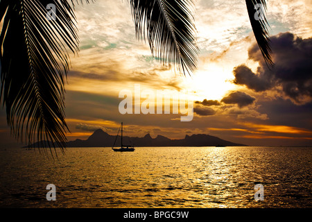 Dramatic sunset over Moorea Island seen from Tahiti Stock Photo