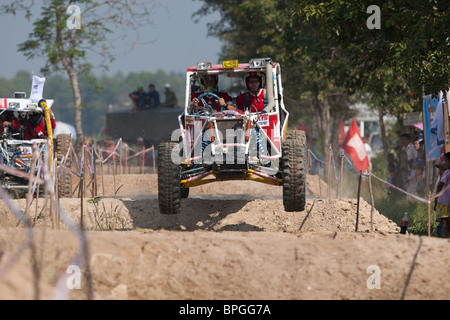 Off-road dune buggy competing in the mud Stock Photo