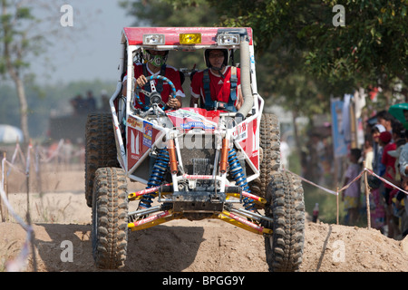 Off-road dune buggy competing in the mud Stock Photo