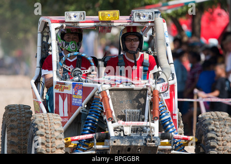 Off-road dune buggy competing in the mud Stock Photo