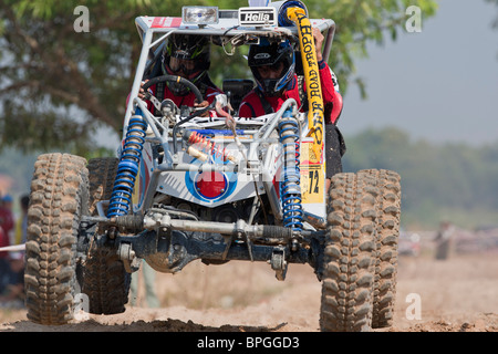 Off-road dune buggy competing in the mud Stock Photo