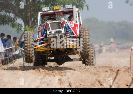 Off-road dune buggy competing in the mud Stock Photo