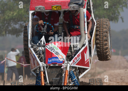 Off-road dune buggy competing in the mud Stock Photo