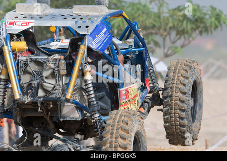 Off-road dune buggy competing in the mud Stock Photo