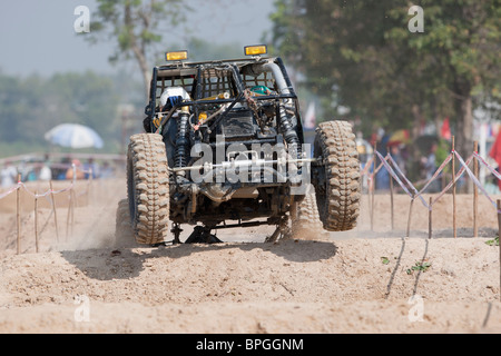 Off-road dune buggy competing in the mud Stock Photo