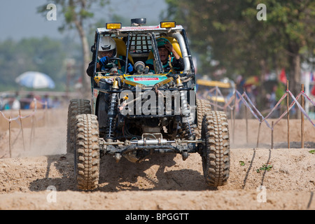 Off-road dune buggy competing in the mud Stock Photo