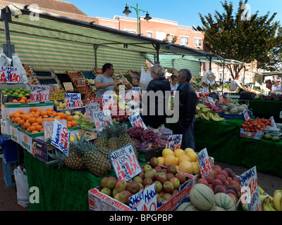 Surrey England Epsom Market People Buying Fruit At Fruit And Vegetable Stall Stock Photo