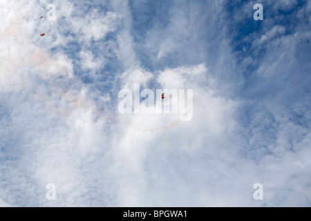 The Red Devils, the British Army and Parachute Regiments's display team, in the sky above the Silverstone race track. Stock Photo