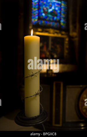 A Church Candle remembering all who suffer injustice in the World, Canterbury Cathedral, Kent Stock Photo