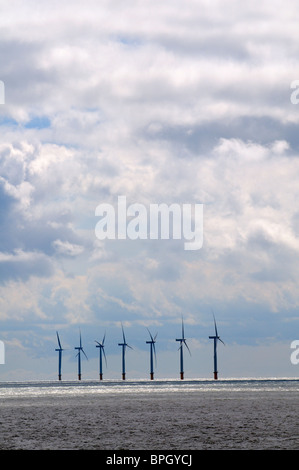 Wind turbines offshore on Gunfleet Sands seen from Clacton on Sea an Essex seaside resort off the west coast of England UK Stock Photo