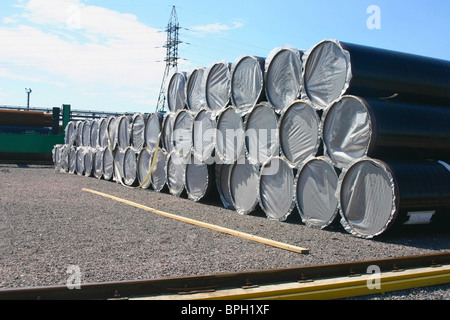 Big diameter iron pipes are on the finished-products storage area. Stock Photo