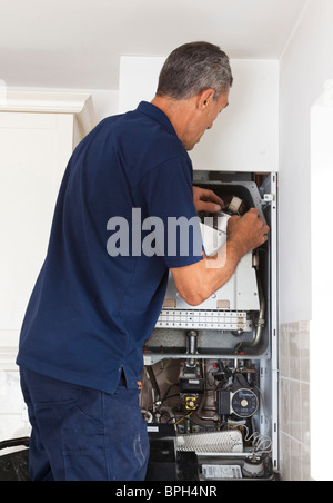 heating engineer working on a gas boiler Stock Photo