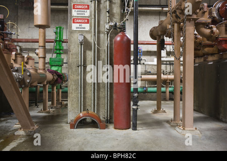 Heavy machinery with compressed gas cylinder in a sewage treatment plant, Massachusetts, USA Stock Photo