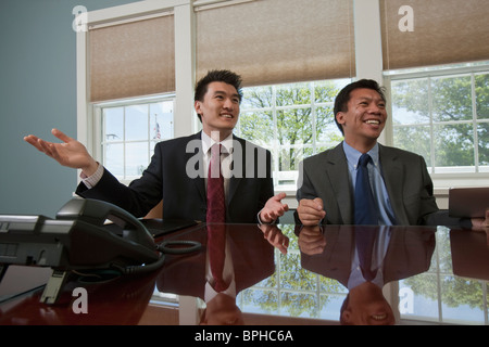 Two businessmen in a board room