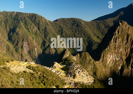 The first view of Machu Picchu that Inca Trail hikers see, from the Sun Gate, Sacred Valley, Peru. Stock Photo