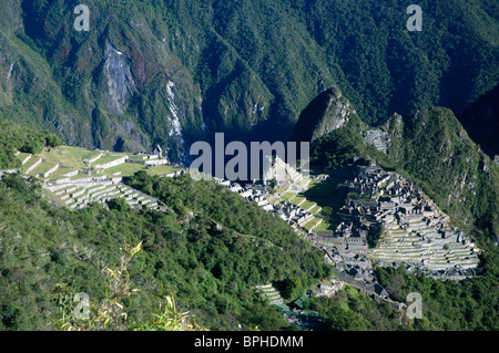 The first view of Machu Picchu that Inca Trail hikers see, from the Sun Gate, Sacred Valley, Peru. Stock Photo