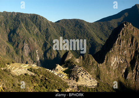 The first view of Machu Picchu that Inca Trail hikers see, from the Sun Gate, Sacred Valley, Peru. Stock Photo