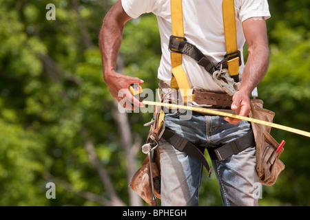 Carpenter making measurements Stock Photo