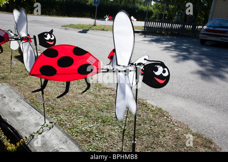 colourful insect shaped weathercocks Stock Photo