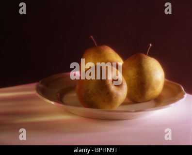 3 pears on a plate, painterly Stock Photo