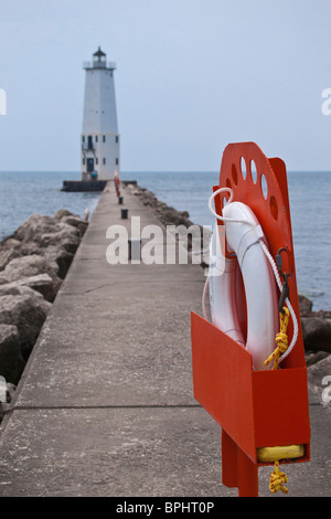 Frankfort North Breakwater Light on Lake Michigan USA White Light house with safety ring circle on a pier leading nobody none no one vertical hi-res Stock Photo
