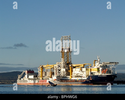 The Stena Carron Deep Water Drill Ship moored at the Nigg Oil Terminal, Cromarty Firth, Scotland. A rib is in the foreground. Stock Photo
