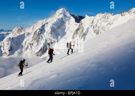 Three back-country skiers, Val Ferret, Canton of Valais, Switzerland Stock Photo