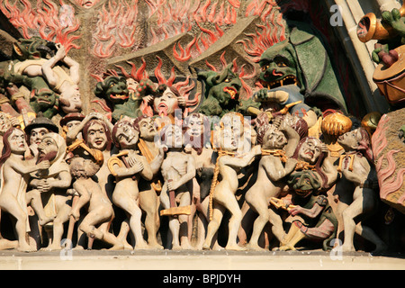 Detail of the carved tympanum above the west door of Bern Cathedral Church. Stock Photo