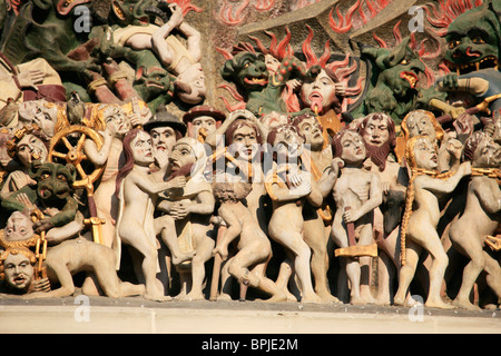 Detail of the carved tympanum above the west door of Bern Cathedral Church. Stock Photo