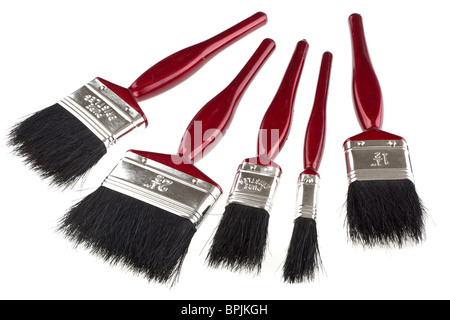 Five different sized red handled paint brushes Stock Photo
