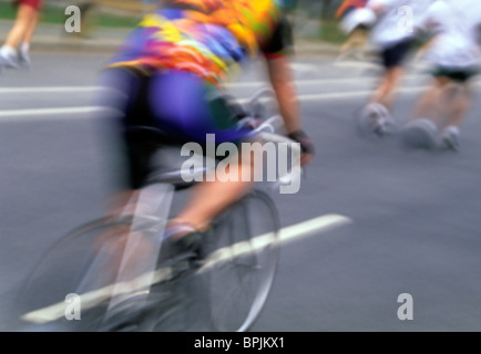 Bike riding in city streets. Motion biker speeding in Central Park, New York City.  Joggers and bikers workout exercise activity Stock Photo