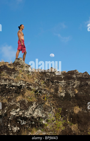 MR Tahitian man in traditional clothing at overlook near Mt. Otemanu in Bora Bora Stock Photo