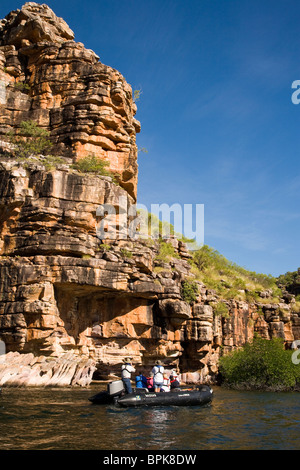 Passengers from Aussie expedition cruiser Orion view some spectacular sandstone scenery King George River Australia Stock Photo