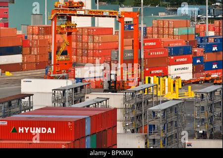 Cargo containers being off loaded in the port city of Vancouver, Canada Stock Photo