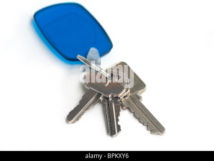 Home keys - set of three with a transparent blue holder. Isolated on white. Stock Photo