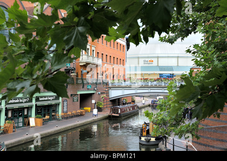 The canal at Brindley Place with the National Indoor Arena in the background, Birmingham. Stock Photo