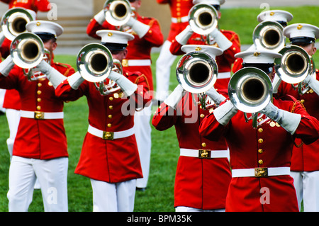 ARLINGTON, Virginia, United States — The United States Marine Drum and Bugle Corps, known as 'The Commandant's Own,' performing at the Marine Corps Sunset Parade at the Marine Corps War Memorial, also known as the Iwo Jima Memorial, near Arlington National Cemetery. This ceremonial unit is renowned for its musical precision and plays a key role in Marine Corps traditions. Stock Photo