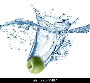 Apple falls deeply under water with a big splash. Stock Photo