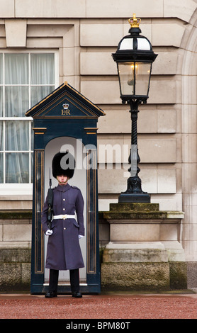 A Royal Household Guard in winter uniform outside Buckingham Palace, London, England. Stock Photo