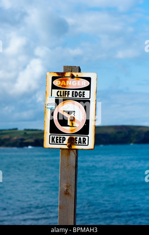 Danger Keep Clear sign warning people of the Cliff edge at Cape Schanck Victoria Australia. Stock Photo