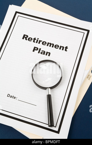 Retirement Plan and Magnifying Glass, business concept Stock Photo