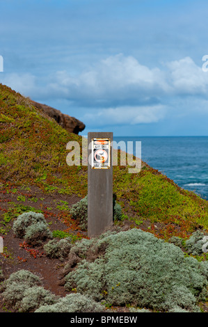 Signs warning of steep cliff edges at Cape schanck Victoria Australia. Stock Photo