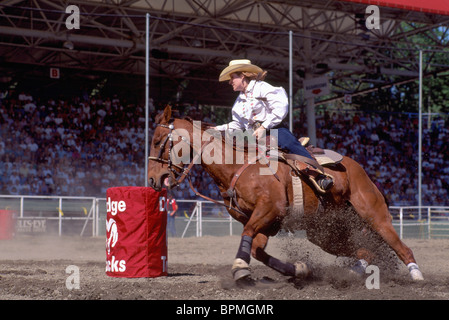 Rodeo Cowgirl riding Horse in Barrel Racing Event, Cloverdale Rodeo, Surrey, BC, British Columbia, Canada Stock Photo